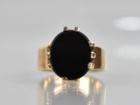 A Onyx and 9ct Gold Signet Ring, Oval Onyx Panel Measuring 14mm by 12.2mm Diameter Raised in Ten