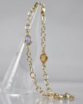 A 9ct Gold Multi-Jewelled Bracelet, Three Pear Cut Stones Comprising Topaz, Amethyst and Citrine (