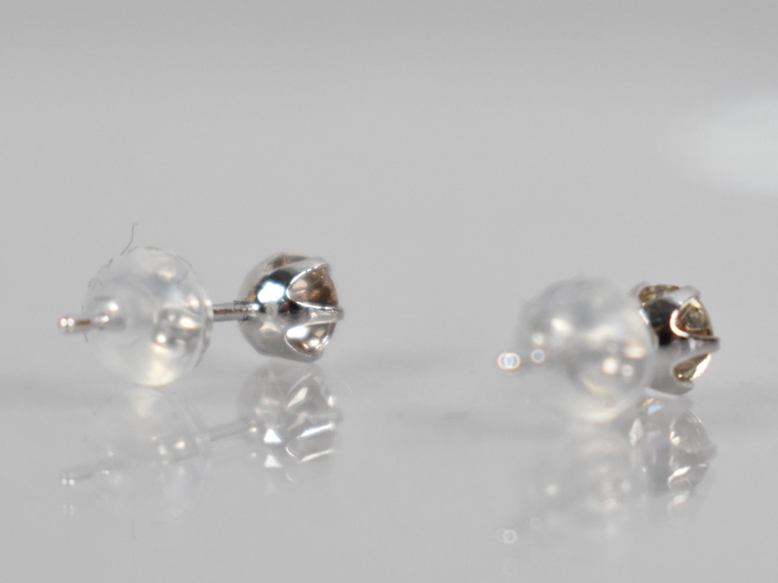 A Pair of Diamond and Platinum Stud Earrings, Round Brilliant Cut Stones Measuring 0.30ct Each (0. - Image 3 of 3