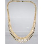 An Italian 9ct Gold Fringe Necklace, Graduated Lozenge Shaped Drops on a Gate Style Chain, Longest