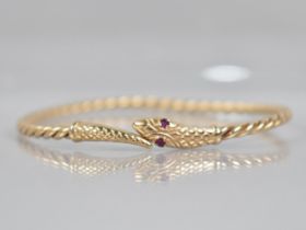 A 9ct Gold Bangle, Snake, Round Cut Ruby Eyes with Engraved Scale Decoration to Head and Tail, and