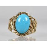 A 9ct Gold and Turquoise Dress Ring, Central Oval Cabochon Stone Measuring 10mm x 13.5mm, Collet Set