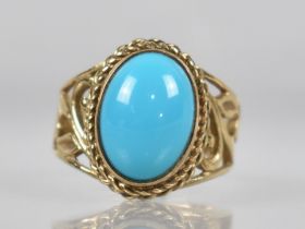 A 9ct Gold and Turquoise Dress Ring, Central Oval Cabochon Stone Measuring 10mm x 13.5mm, Collet Set