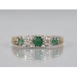 An Emerald and Diamond Five Stone Boat Ring, Central Mixed Cut Emerald Measuring 18.7mm by 17mm in