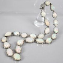 An Opal and Diamond Necklace, 23 Mixed Shape Matched Opals Comprising Pear and Oval Cabochon, 93.