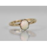 A 9ct Gold Opal Mounted Ring, Oval Cabochon Stone 7.2mm by 5.5mm, Raised in Eight Claws to Reverse