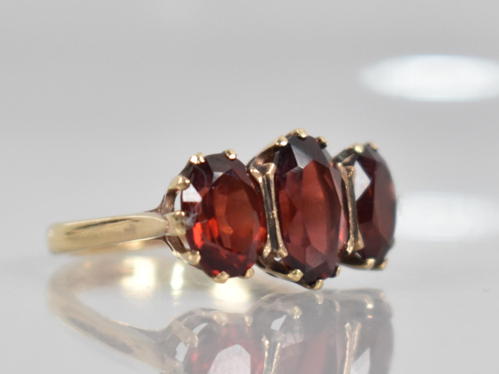 A 9ct Gold and Garnet Dress Ring, Central Oval Cut Stone Measuring 9.9mm by 6.5mm, Claw and - Image 3 of 3