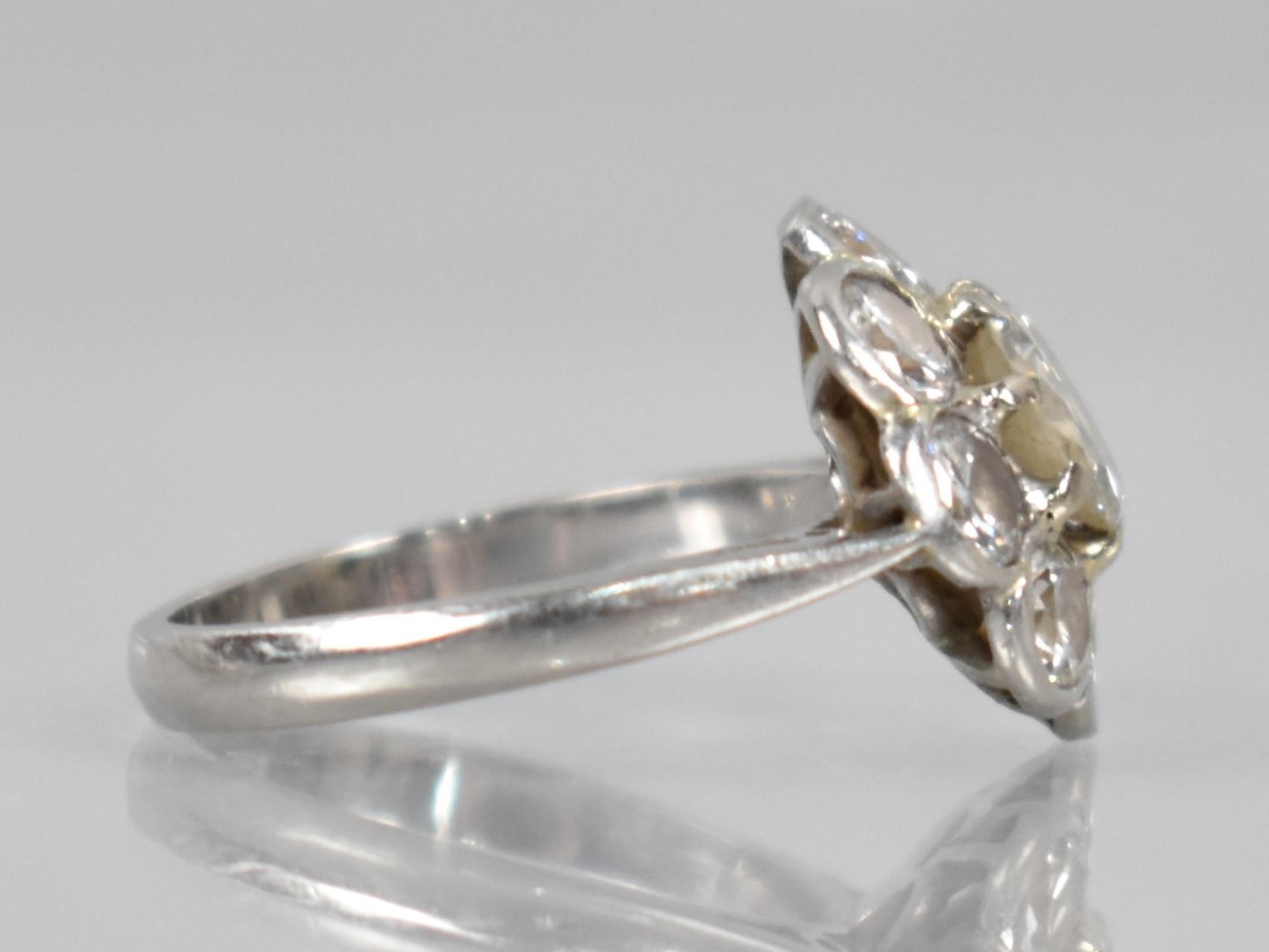 A Platinum and Diamond Daisy Cluster Ring (At Fault), Central Round Cut Diamond Measuring 6.31mm - Image 3 of 14