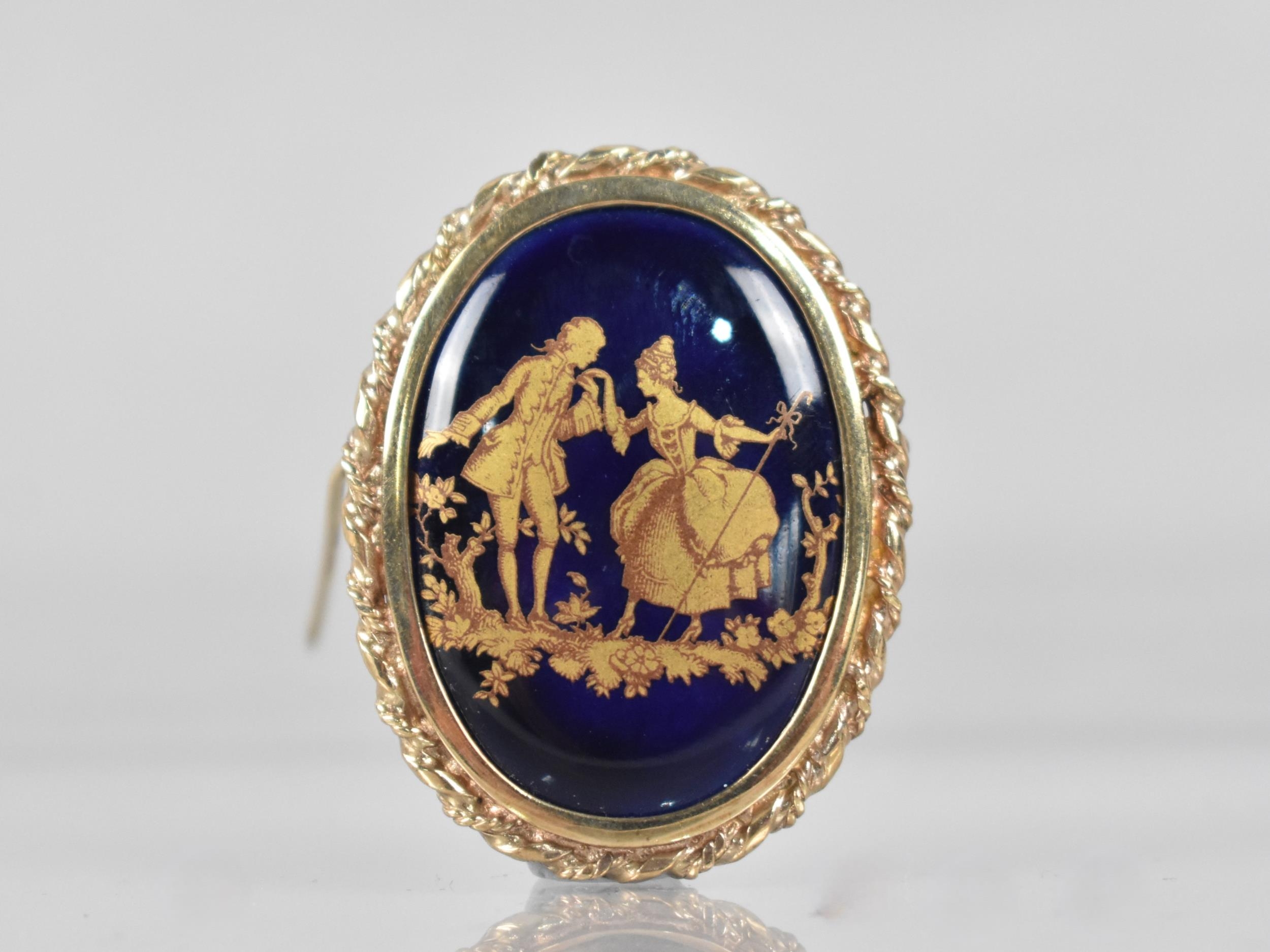 A 9ct Gold Framed Limoges Brooch, Blue Enamelled Ground with Gilt Decoration Depicting Lovers in