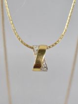 An 18ct Gold and Diamond Pendant, Round Cut Diamonds in White Metal to an 'X' Framed Pendant,