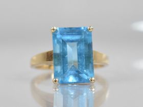 A 14ct Gold Mounted Blue Stone Ring, Testing as Sapphire, Emerald Cut Measuring 13.9mm by 9.7mm