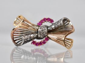 A Large Diamond and Ruby Bow Brooch in Gold and White Metal, Comprising 25 Rose Cut Diamonds, Each