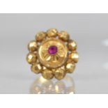 An Indian Gold Coloured Metal and Ruby Ring, Central Ruby Measuring 3.6mm by 3.0mm in a Raised