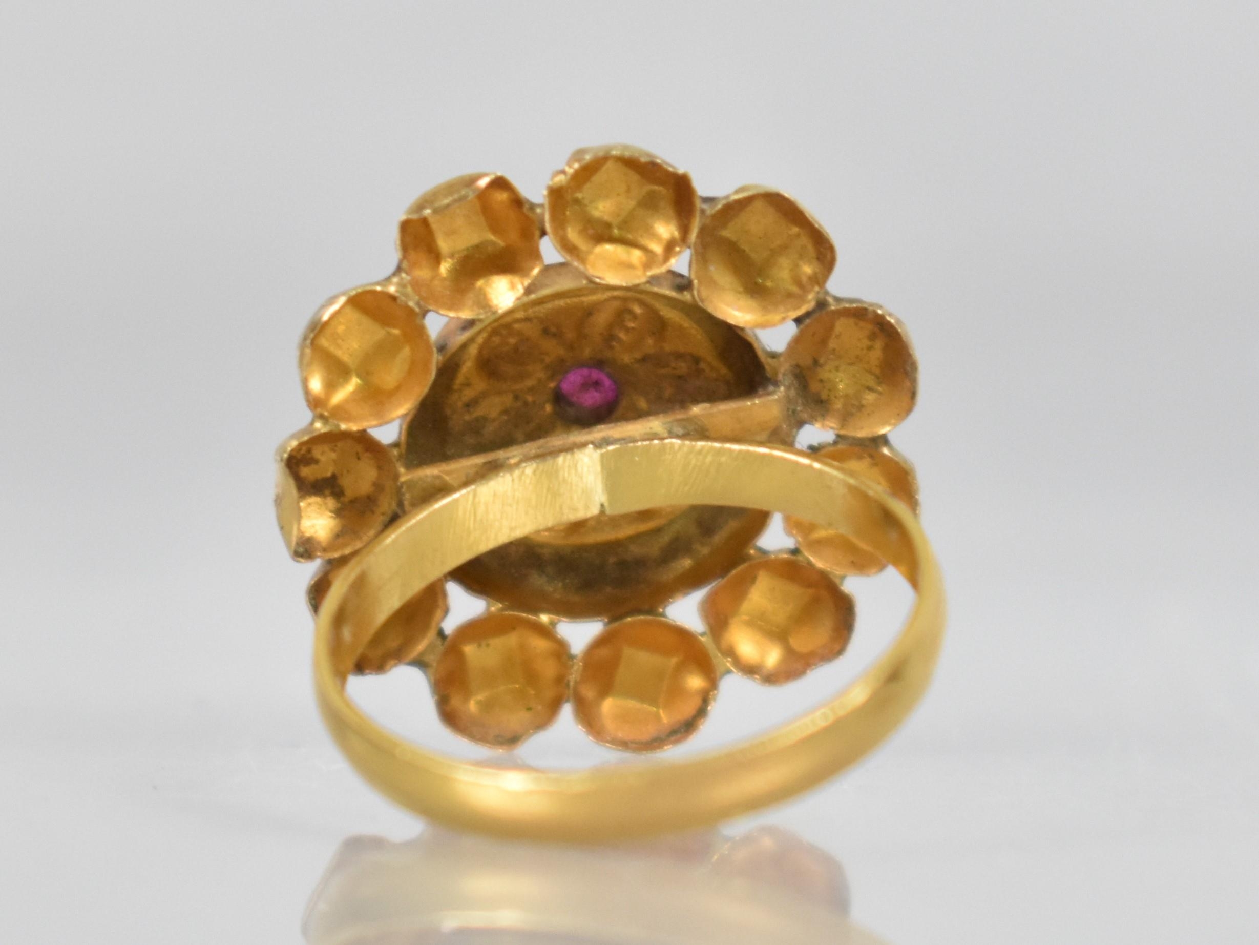 An Indian Gold Coloured Metal and Ruby Ring, Central Ruby Measuring 3.6mm by 3.0mm in a Raised - Image 2 of 2