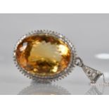 A Large Citrine and Diamond Mounted White Metal Pendant, Central Oval Cut Citrine Measuring 44.