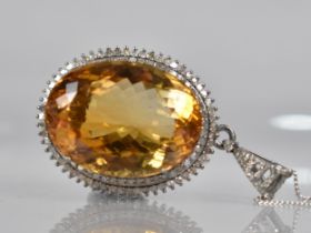 A Large Citrine and Diamond Mounted White Metal Pendant, Central Oval Cut Citrine Measuring 44.