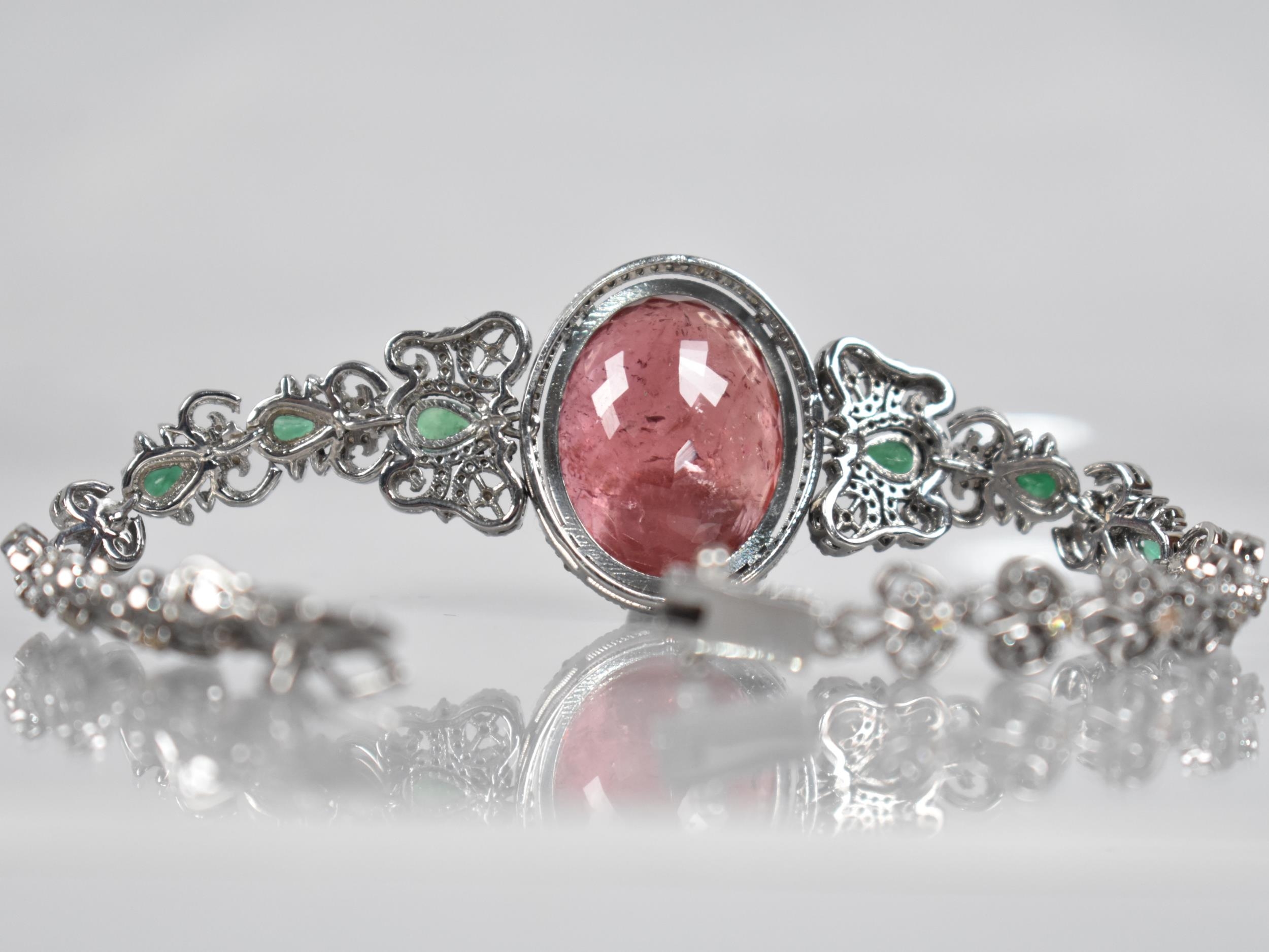 A Rubellite, Emerald and Diamond Bracelet. Large Oval Cut Rubellite Stone Measuring 26.42cts, 22.9mm - Image 3 of 3