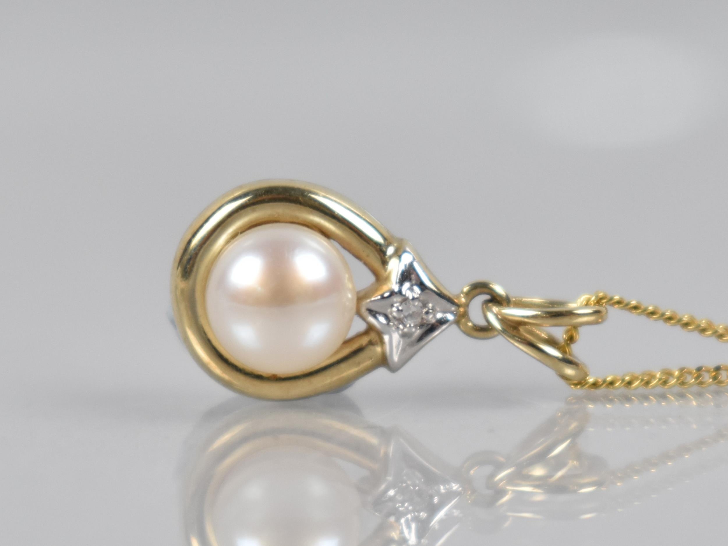 A 9ct Gold Pendant, Pearl with Bead Bright Set Diamond, on 9ct Gold Italian Flattened Curb Link