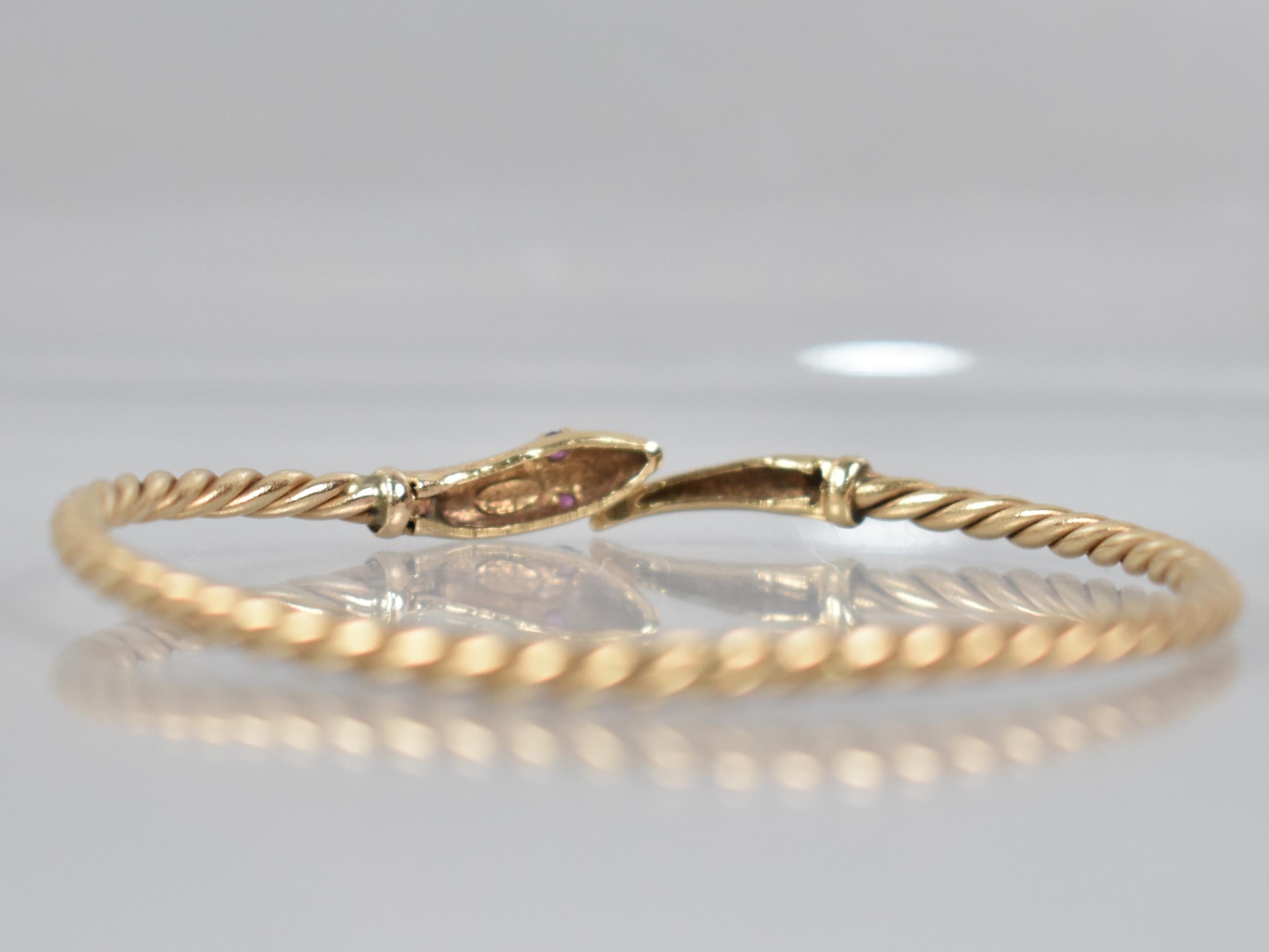 A 9ct Gold Bangle, Snake, Round Cut Ruby Eyes with Engraved Scale Decoration to Head and Tail, and - Image 5 of 5