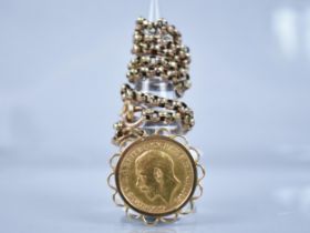 A 1913 George V Sovereign, Mounted in Gold Metal and on a Faceted Belcher Link Chain having Oval