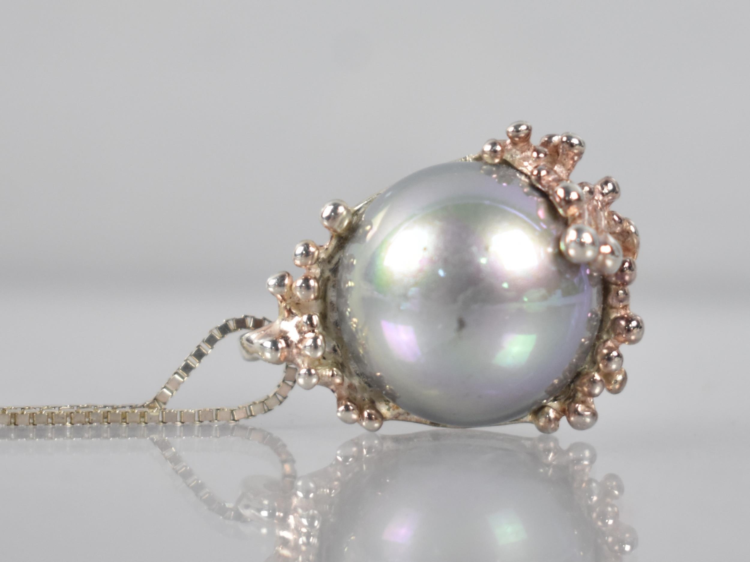 Astri Hilde Holthe: A Norwegian Silver Mounted Pendant of Organic Form with Centre Faux Pearl on