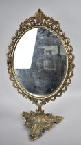 A Mid 20th Century Brass Oval Dressing Table Mirror with Pierced Border, Triform Base, 49cms High