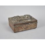 A Silver Plated Japanese Copper Box Decoration in Relief with Dragons, 12cms Wide