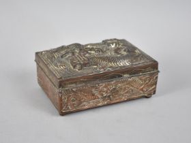 A Silver Plated Japanese Copper Box Decoration in Relief with Dragons, 12cms Wide