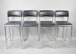 A Set of Four Chromed Based Kitchen Bar Stools