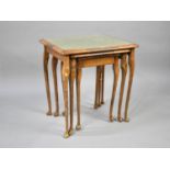 A Modern Nest of Three Tables with Tooled Leather Tops under Glass, 53cms Wide