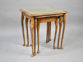 A Modern Nest of Three Tables with Tooled Leather Tops under Glass, 53cms Wide