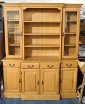 A Modern Light Oak Breakfront Dresser, the Base with Four Drawers Over Cupboards, Raised Central