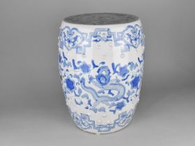A Reproduction Blue and White Chinese Barrel Shaped Seat with Pierced Body, 32cms Diameter and 44cms
