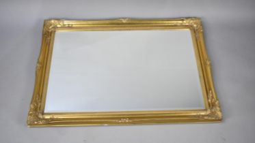 A Modern Gilt Framed Rectangular Wall Mirror, 105cms by 76cms