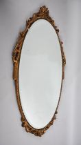A Mid 20th Century Gilt Metal Framed Oval Wall Mirror with Bevelled Glass, 74x40cms