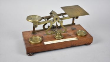 An Edwardian Brass Postage Scale on Rectangular Mahogany Plinth, 20cms Wide