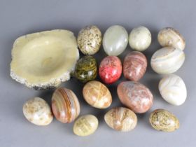 A Collection of Various Polished Stone Eggs and an Ashtray