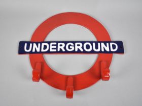 A Cold Painted Metal Novelty Coat Rack in the From of London Underground Sign, 39cms Wide