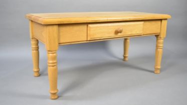 A Modern Rectangular Coffee Table with Single Drawer on Turned Supports, 102cms Wide