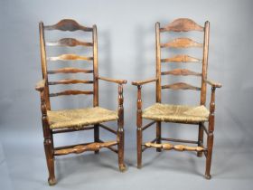 A Pair of Rush Seated Ladder Back Armchairs