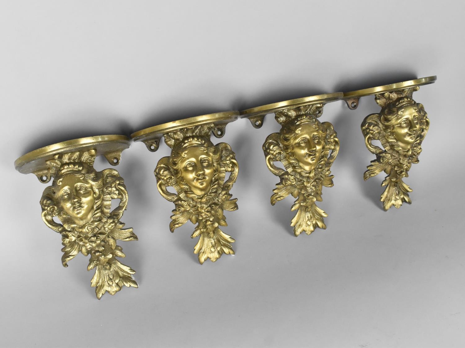 A Set of Four Cast Brass Wall Sconces Modelled with Maidens Head Amongst Foliage and Acanthus - Image 2 of 2