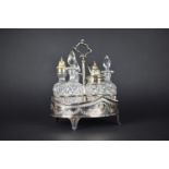 A Glass and Silver Plate Six Bottle Cruet on Silver Plated Stand