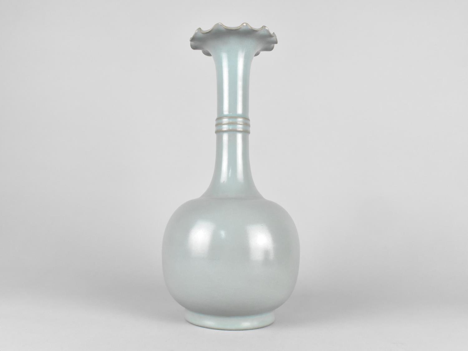 A Chinese Monochrome Bottle Vase with Flared Wavy Rim, Nine Character Mark to Base, 31cms High