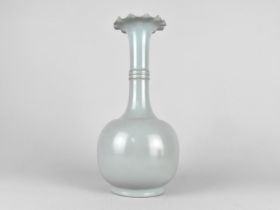 A Chinese Monochrome Bottle Vase with Flared Wavy Rim, Nine Character Mark to Base, 31cms High
