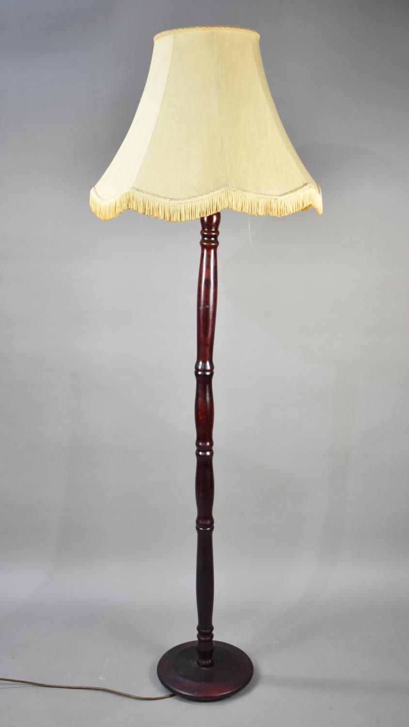 A Mahogany Standard Lamp with Shade
