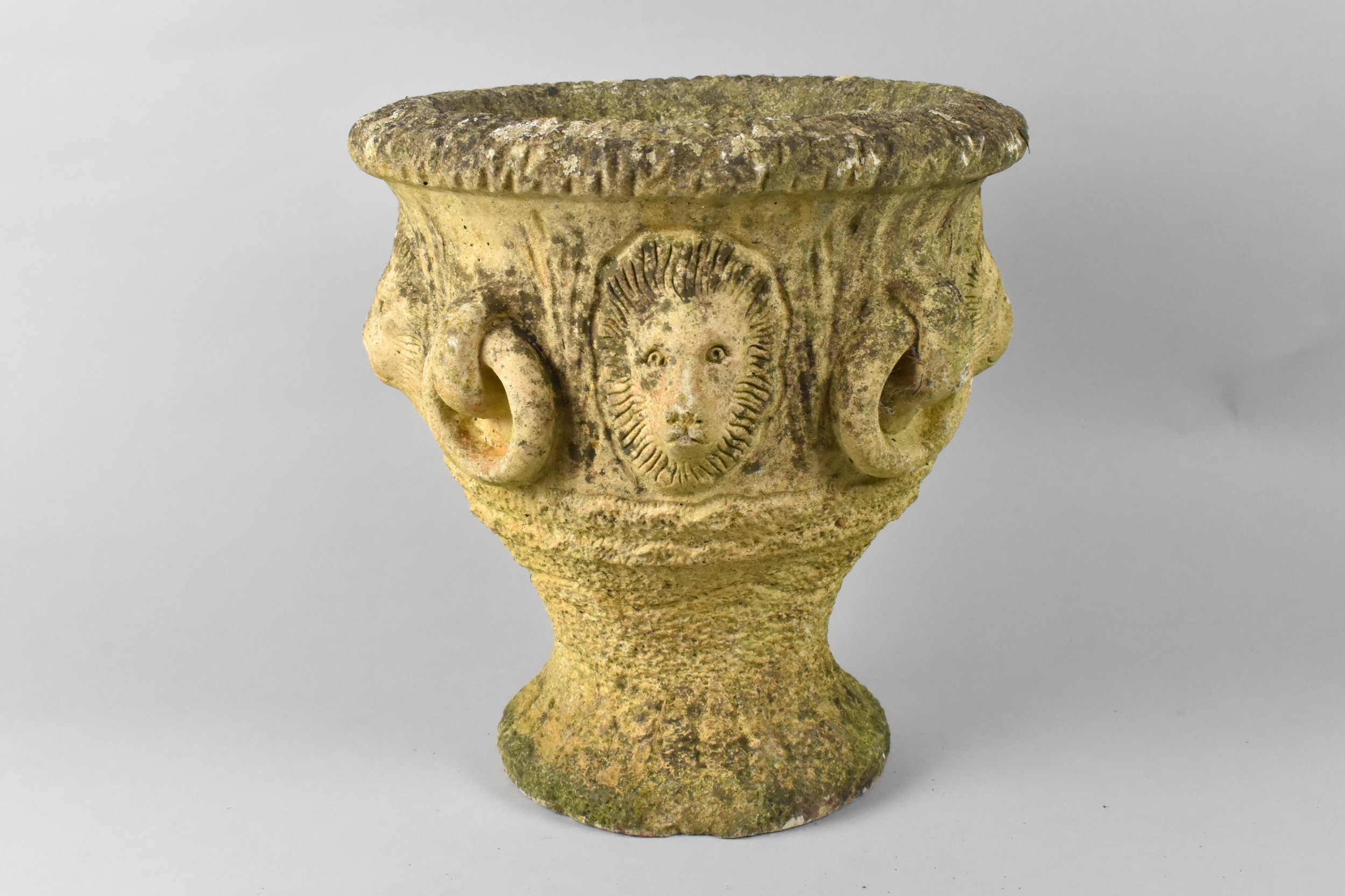 A Small Reconstituted Stone Garden Planter with Lion Head Relief Decoration, 27cms High