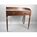 A 19th Century Mahogany Galleried Side Table with Two Single Drawers on Turned Supports, 89x46x82cms