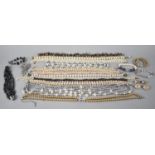 A Large Collection of Pearl and Faux Pearl Necklaces and Clip on Earrings to include Some with Gold,