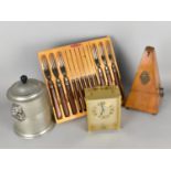 A Canteen Set of Pagwood Knives and Forks, a Pewter Lidded Pot with Lion Ring Mask Handles, Paquet
