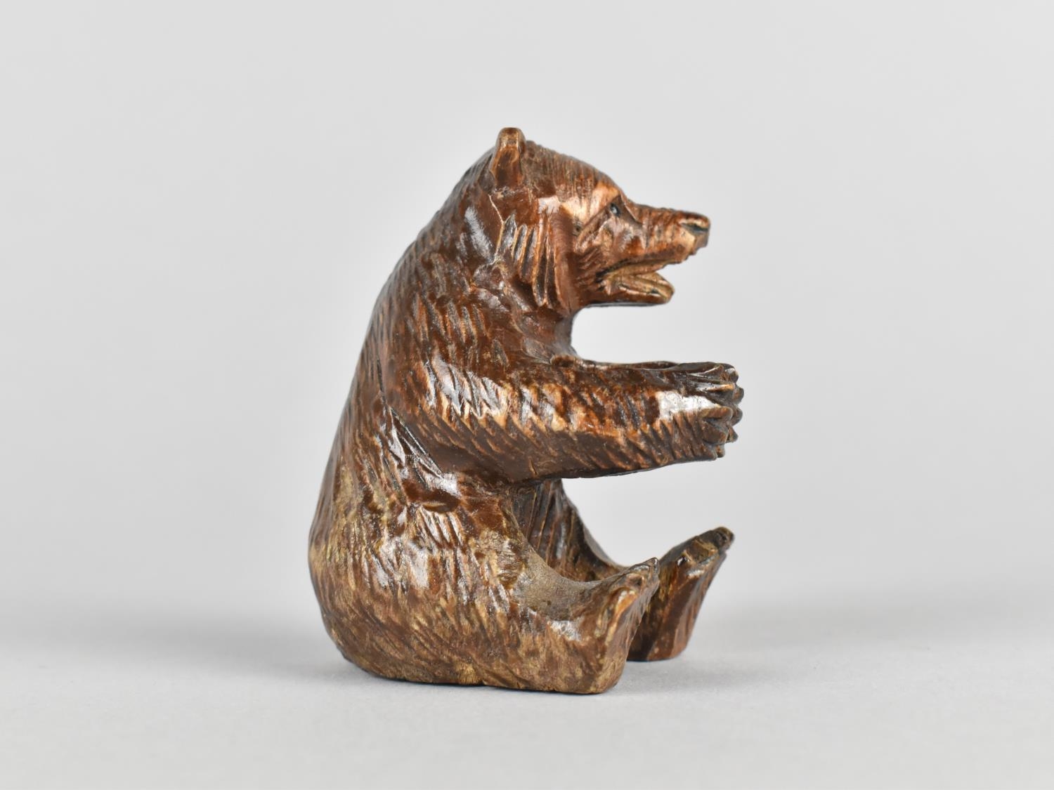 A Black Forest Carved Wooden Bear, Modelled Seated, 6cms High - Image 2 of 2